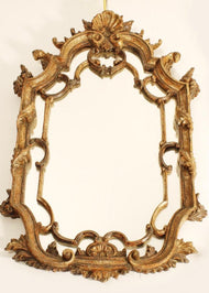Venetian rococo carved giltwood mirror with shell cresting