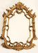 Venetian rococo carved giltwood mirror with shell cresting
