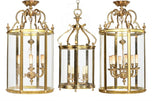 Pair of Gilt Brass Cylindrical Hall Lanterns, together with a Third Lantern
