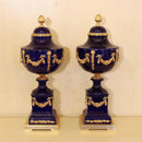 Pair of Sèvres-Style Cobalt Porcelain and Gilt Bronze Lidded Urns