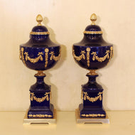 Pair of Sèvres-Style Cobalt Porcelain and Gilt Bronze Lidded Urns
